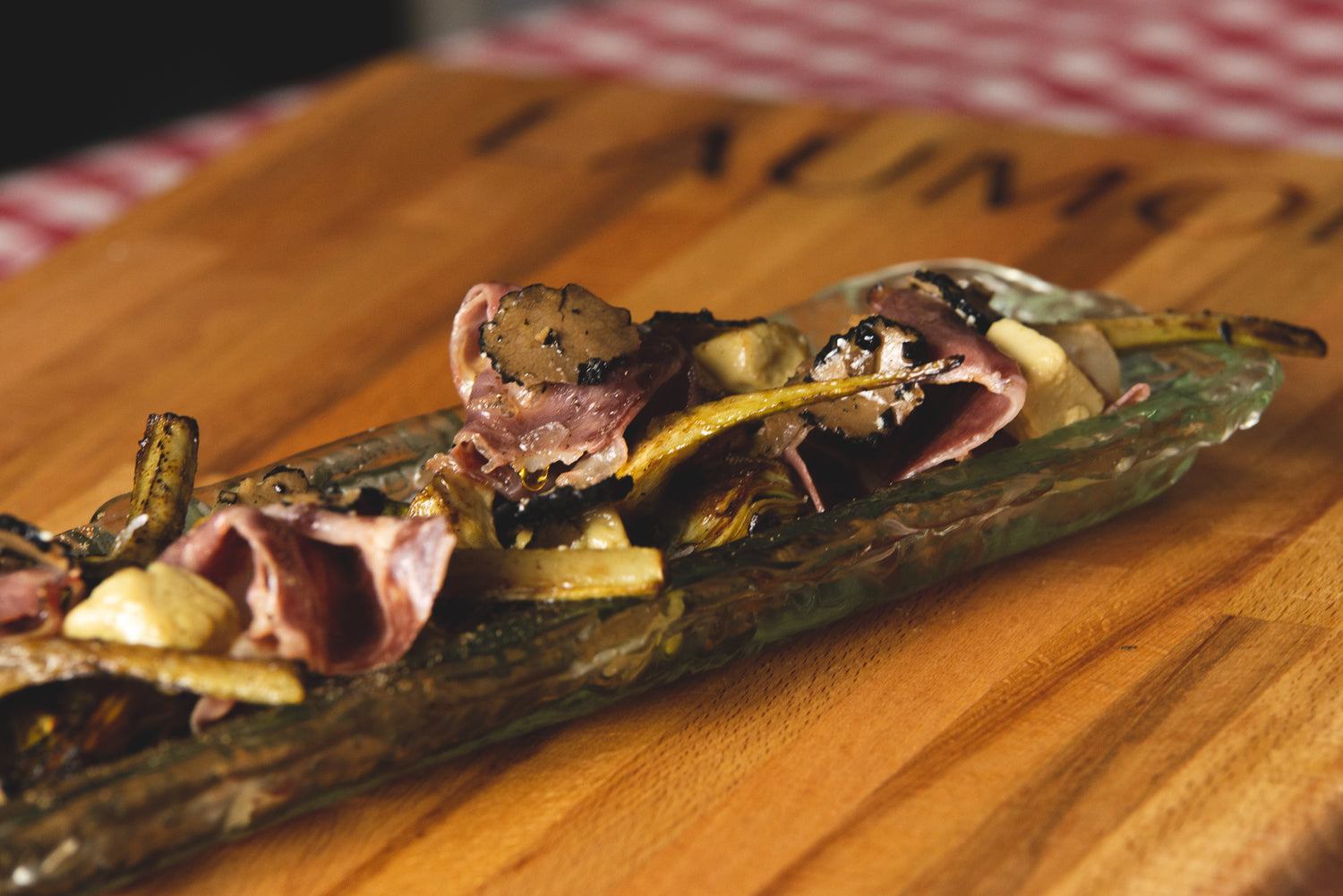 Sautéed Artichokes with Iberian Ham, Foie Micuit and Black Truffle Carpaccio