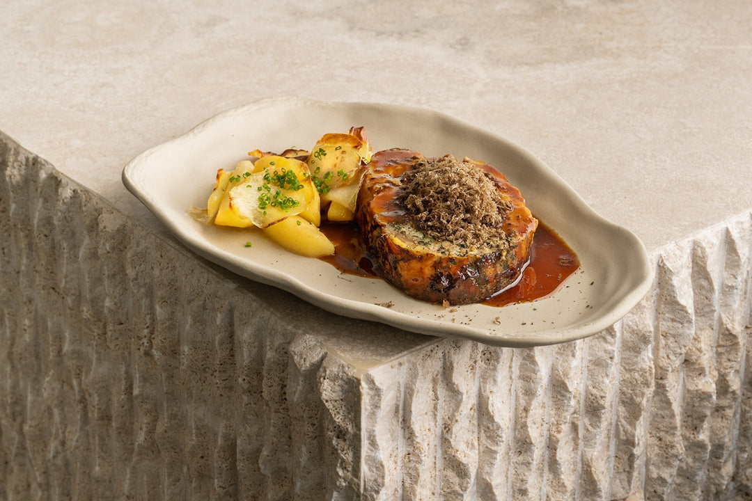 Chicken stuffed with truffle, roast juice and apple with potato